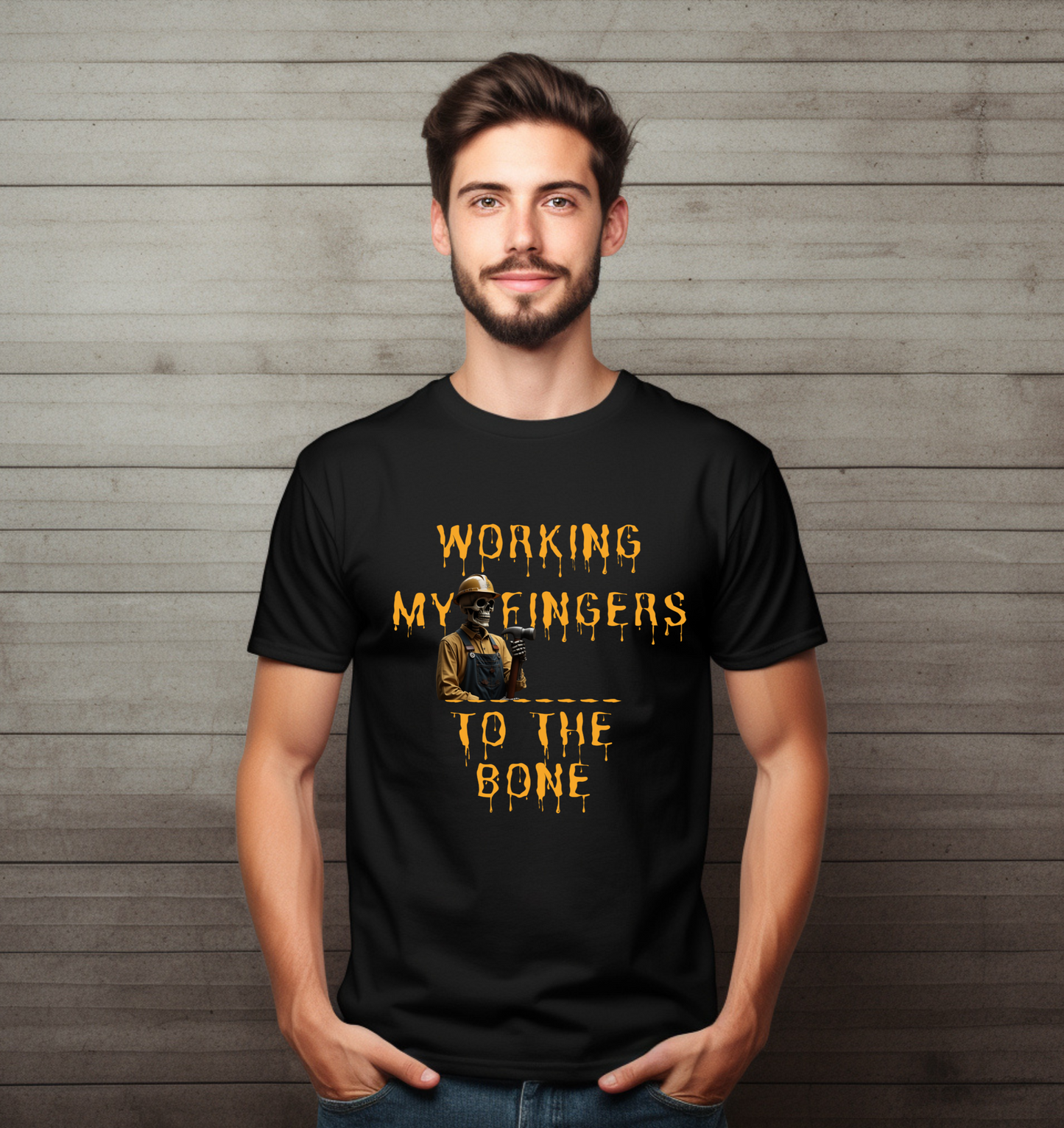 Man wearing a black t-shirt with yellow text and graphic against a wooden background